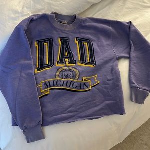 Vintage university of Michigan sweatshirt. Arm holes are cut. Purple.